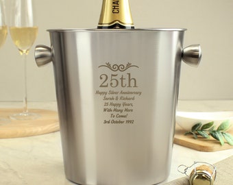 May include: Silver champagne bucket with engraved text: "25th Happy Silver Anniversary Sarah & Richard 25 Happy Years, With Many More To Come! 3rd October 1992".