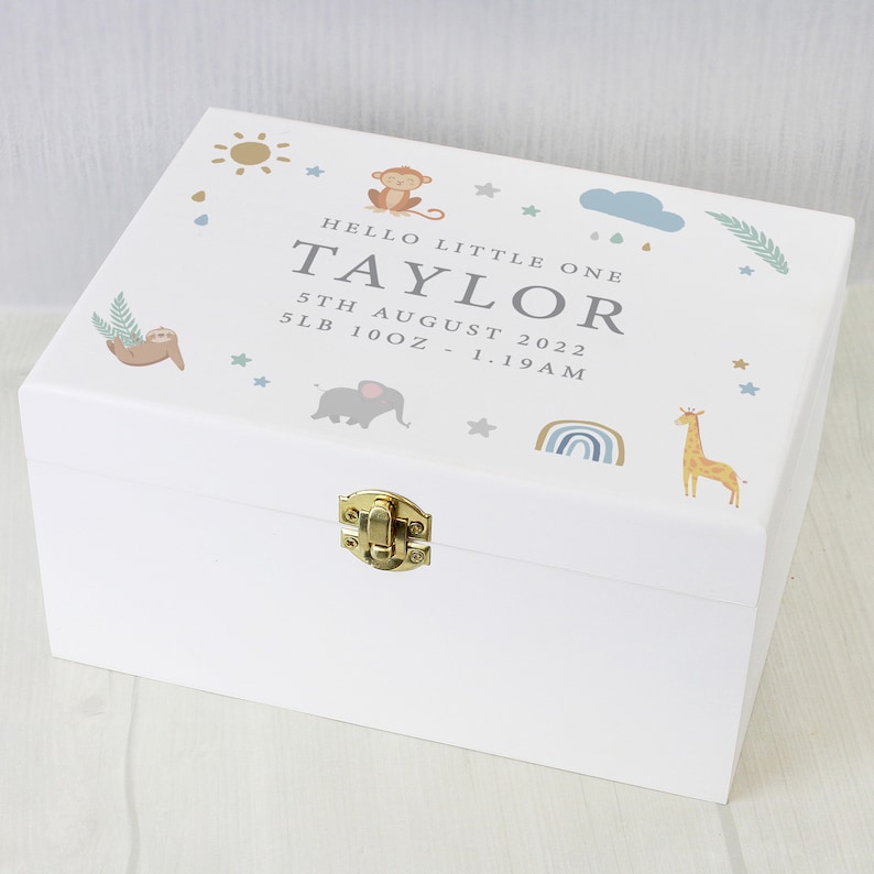 May include: White wooden keepsake box with a gold latch. The box is decorated with a jungle animal theme, including a monkey, elephant, sloth, giraffe, and rainbow. The text on the box reads "Hello Little One Taylor 5th August 2022 5lb 10oz - 1:19AM"