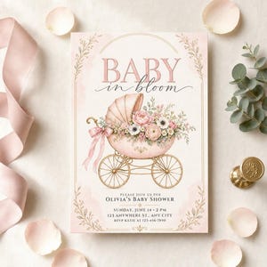 May include: A rectangular baby shower invitation card featuring the text BABY in bloom, an illustration of a vintage baby carriage filled with pink and white flowers, and event details for Olivia's Baby Shower on Sunday, June 14 at 2 PM.
