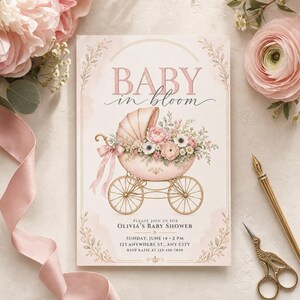 May include: A rectangular baby shower invitation card featuring the text BABY in bloom. The design includes a vintage-style pink baby carriage filled with pink and white flowers, accented by a pink ribbon bow, gold wheels, and delicate floral borders.