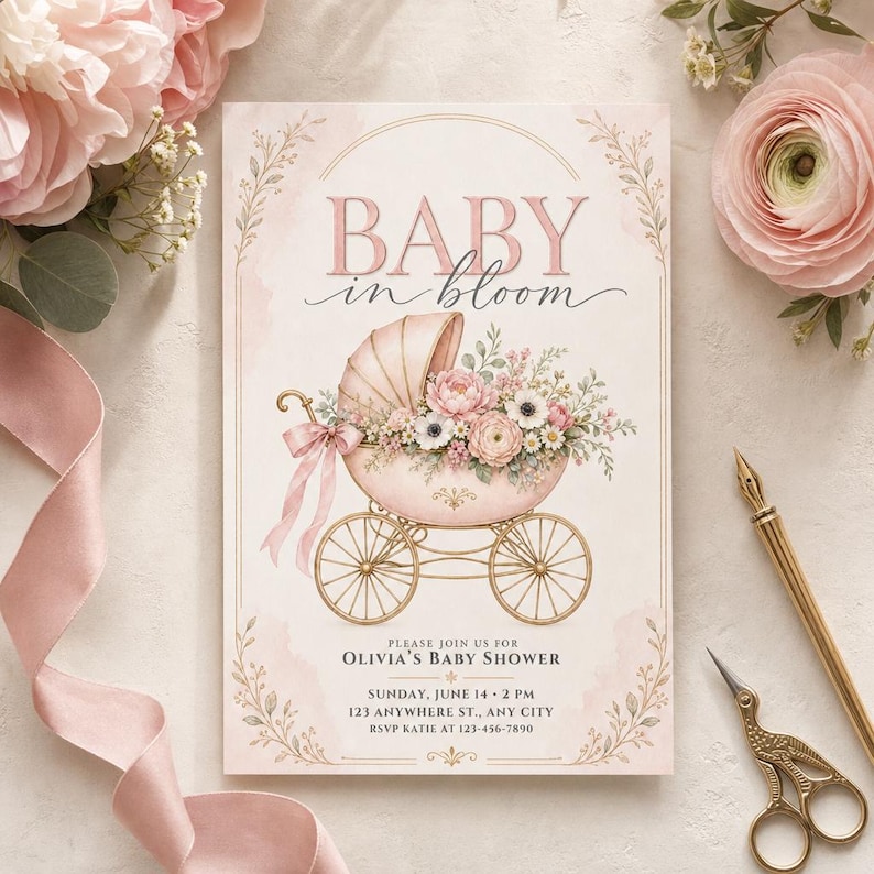 May include: A rectangular baby shower invitation card featuring the text BABY in bloom. The design includes a vintage-style pink baby carriage filled with pink and white flowers, accented by a pink ribbon bow, gold wheels, and delicate floral borders.