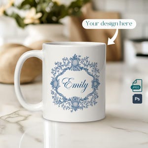May include: White ceramic mug featuring a blue and white floral design with the name "Emily" in a decorative font.