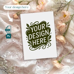 May include: A white book with the text "YOUR DESIGN HERE" in a green, decorative font. The book is surrounded by peach-colored flowers and lace fabric. The image also includes a JPEG icon and a Ps icon.