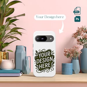 May include: White phone case with a black camera area and the text "YOUR DESIGN HERE" in green. The case is on a wooden surface with decorative vases and plants in the background. The text "Your Design here" is above the phone case.