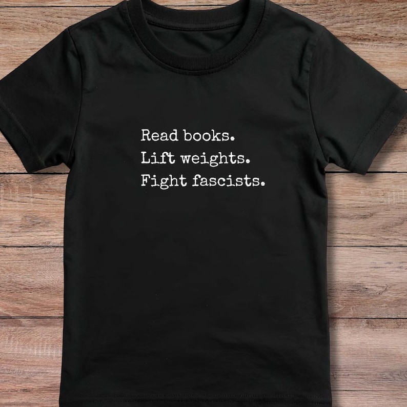 Statement Clothing Design Activist Message Apparel Book Gym Shirt Reading Workout Tee Intellectual Fitness Theme Bold Graphic Print Comfortable Fabric Multiple Sizes Available Perfect Gift Idea Unique Present Option Special Occasion Choice