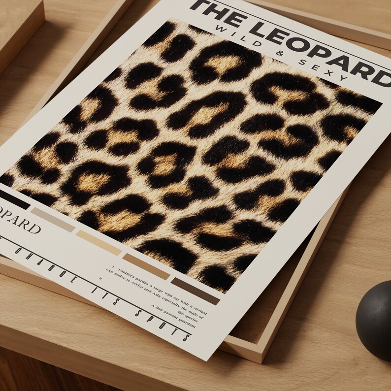 May include: A poster with a leopard print background and the text "THE LEOPARD WILD & SEXY" at the top. The text "PARD" is at the bottom left corner. The text "IT'S SPOTS" is at the bottom right corner. The poster has a color palette of brown, tan, and black.