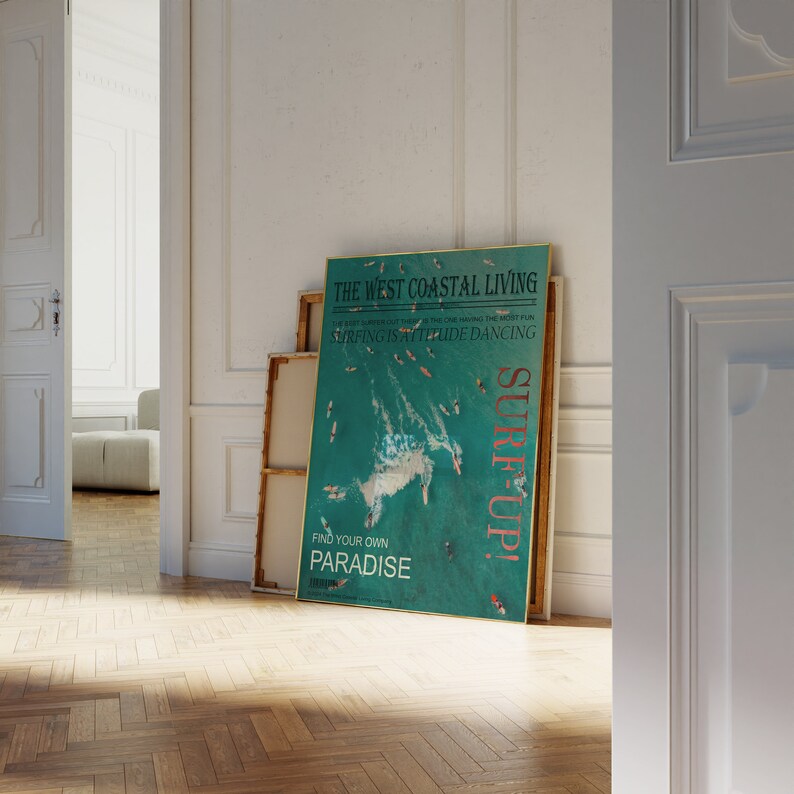 May include: A teal and white poster with the text "The West Coastal Living" and "Surf Up!" in a pink and white font. The poster features a photo of a turquoise ocean with people surfing and the text "The best summer out there is one having the most fun. Surfing is attitude dancing. Find your own paradise."