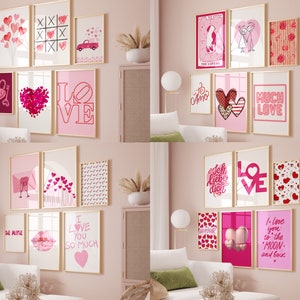 May include: A pink wall gallery featuring a collection of framed prints with Valentine's Day themes. The prints feature hearts, love-themed text, and other romantic imagery.