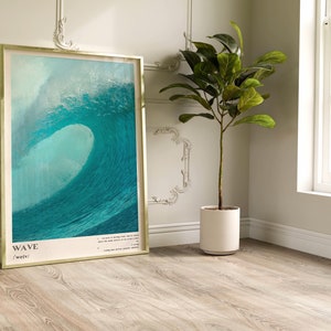 May include: A framed poster with a photograph of a large, blue wave crashing. The poster has the word "WAVE" in large, bold letters at the bottom, with the phonetic spelling "weyv" underneath.