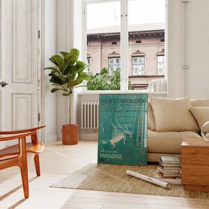 May include: A teal and white poster with the text "The West Coastal Living" and "Surf is Attitude Dancing" with a graphic of a white island with a blue ocean and white fish. The poster also has the text "Setup!" and "Find Your Own Paradise".