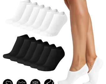 May include: A set of 10 pairs of no-show socks, 5 pairs in white and 5 pairs in black. The socks are made of a soft, breathable fabric and are designed to be comfortable and invisible under shoes. The socks are shown on a model's feet.
