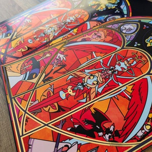 May include: A stained glass style print featuring a red, black, and white character with wings and a halo. The character is holding a sword and a key. The background is a vibrant orange and yellow.