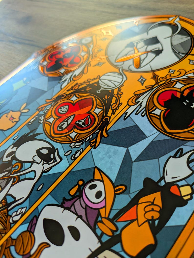 May include: A detailed illustration with a stained-glass aesthetic. The artwork features a vibrant colour palette of orange, blue, and red, with stylized figures and geometric shapes. The design has a fantasy theme, with intricate details and a decorative border.