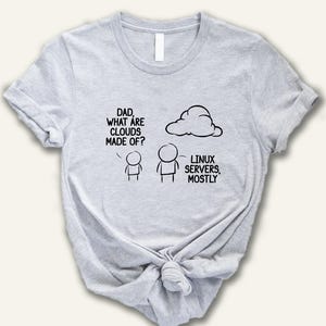 May include: A light gray crew neck t-shirt featuring a black line art graphic of two stick figures and a cloud. The text reads: DAD, WHAT ARE CLOUDS MADE OF? LINUX SERVERS, MOSTLY. The shirt has short sleeves and a standard fit with a knotted hem.