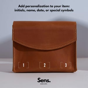 a brown leather wallet with numbers on it