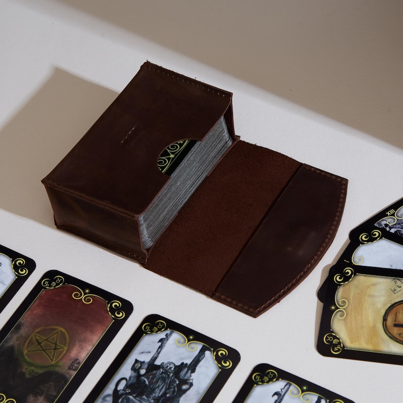 a table topped with cards and a box of cards