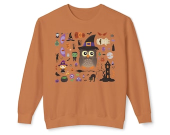 May include: A burnt orange long-sleeve sweatshirt featuring a central graphic print of a large owl wearing a witch hat surrounded by various Halloween-themed icons including a mummy, a witch, a black cat, a cauldron, and a haunted house.