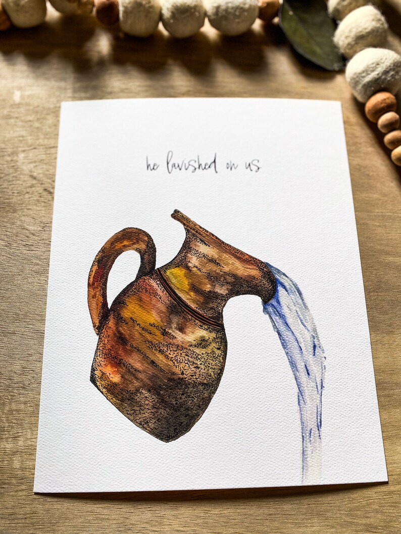 May include: A watercolor painting of a brown clay pitcher pouring water. The text "he lavished on us" is written above the pitcher.