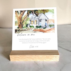 Memory Verse Scripture Card of "believe in me" and watercolor painting artwork, along with an oak wood display stand.