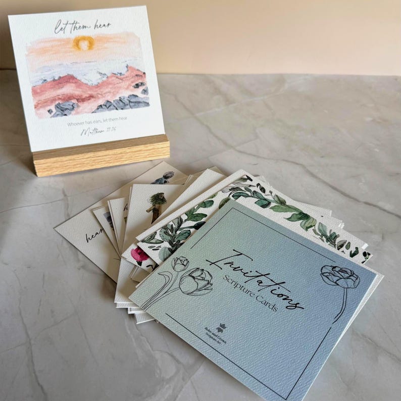 Memory Verse Scripture Card of "Let them hear" and watercolor painting artwork, along with an oak wood display stand. Other scripture cards displayed