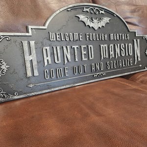Haunted Mansion welcome sign