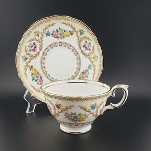 Vintage Crown Staffordshire Floral and Laurels Pattern Footed Cup and Saucer Set No. F15744. Circa 1930&#39;s.