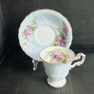 Vintage EB Foley Bone China England Light Blue Cabbage Rose Pattern Footed Cup and Saucer Set. Circa 1948-1963