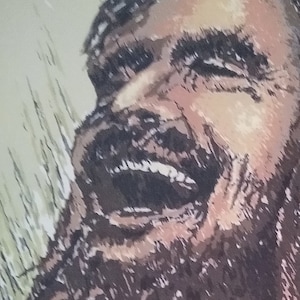May include: A black and white drawing of Jesus laughing with a long beard and hair. The drawing is on a light beige background with the text "Jesus Laughing" at the bottom.