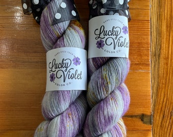 Hand dyed yarn. Lucky violet color co. Yarn. Purple and gold