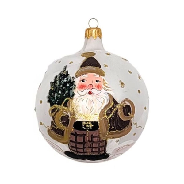 Hand-painted Santa holding a tree ornament