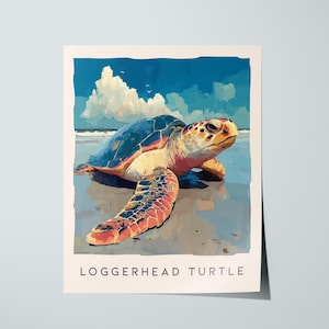 May include: A Loggerhead Turtle art print. The artwork depicts a sea turtle on a sandy beach with a blue sky and clouds in the background. The turtle has a brown, orange, and blue shell. The print has a cream-colored border.