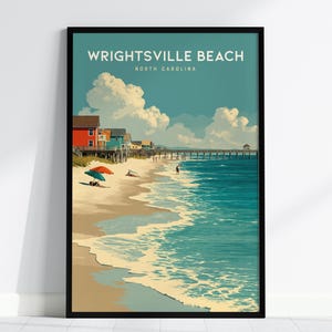 May include: A framed art print of Wrightsville Beach, North Carolina. The artwork shows a beach scene with colourful houses, a pier, and people enjoying the ocean. The sky is a light blue with fluffy white clouds, and the water is turquoise.