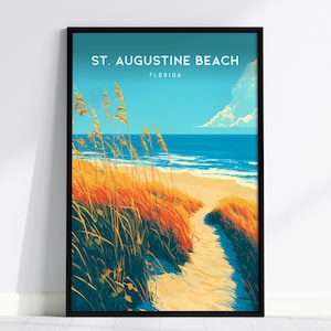 May include: A framed vertical art print featuring a beach scene with a sandy path leading to the ocean. The text reads ST. AUGUSTINE BEACH FLORIDA. The foreground shows tall orange and yellow beach grass, while the background displays a blue sky.
