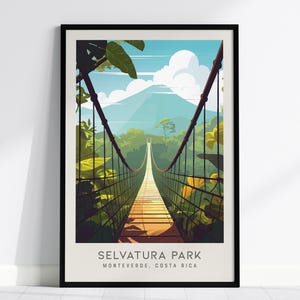 May include: A framed travel poster featuring a hanging bridge leading toward a mountain peak under a blue sky with white clouds. The lush green forest surrounds the bridge. The text at the bottom reads SELVATURA PARK MONTEVERDE, COSTA RICA.