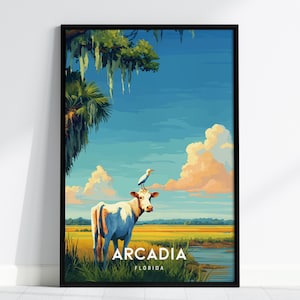 Puede incluir: Una impresión artística enmarcada que presenta una vaca con un pájaro en la cabeza, ambientada en un paisaje vibrante. La escena incluye un cielo azul, nubes esponjosas y el texto "Arcadia Florida" en la parte inferior. La obra de arte es de estilo ilustrativo y colorido.