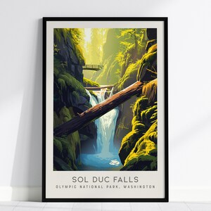 May include: A framed art print featuring a stylized illustration of Sol Duc Falls in Olympic National Park, Washington. The image depicts a waterfall cascading between mossy rock walls, with a large fallen log crossing the gorge and a small footbridge.