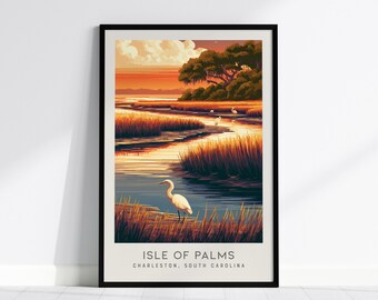 May include: A framed vertical art print featuring a sunset landscape of the Isle of Palms in Charleston, South Carolina. The scene depicts a white egret in the foreground, marsh grasses, a winding waterway, and trees under a warm orange sky.