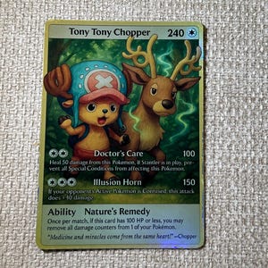 May include: A collectible trading card featuring Tony Tony Chopper, a cartoon character with a blue hat and a reindeer companion. The card has a gold border and includes text describing the character's abilities and attacks.