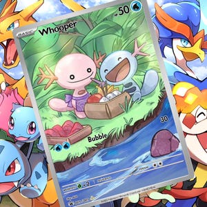 Op de afbeelding: Een Pokémon-kaart met twee Whooper-personages die picknicken bij een rivier. De kaart heeft een groene en blauwe achtergrond met het woord "Whooper" bovenaan. Andere Pokémon-personages zijn op de achtergrond te zien.
