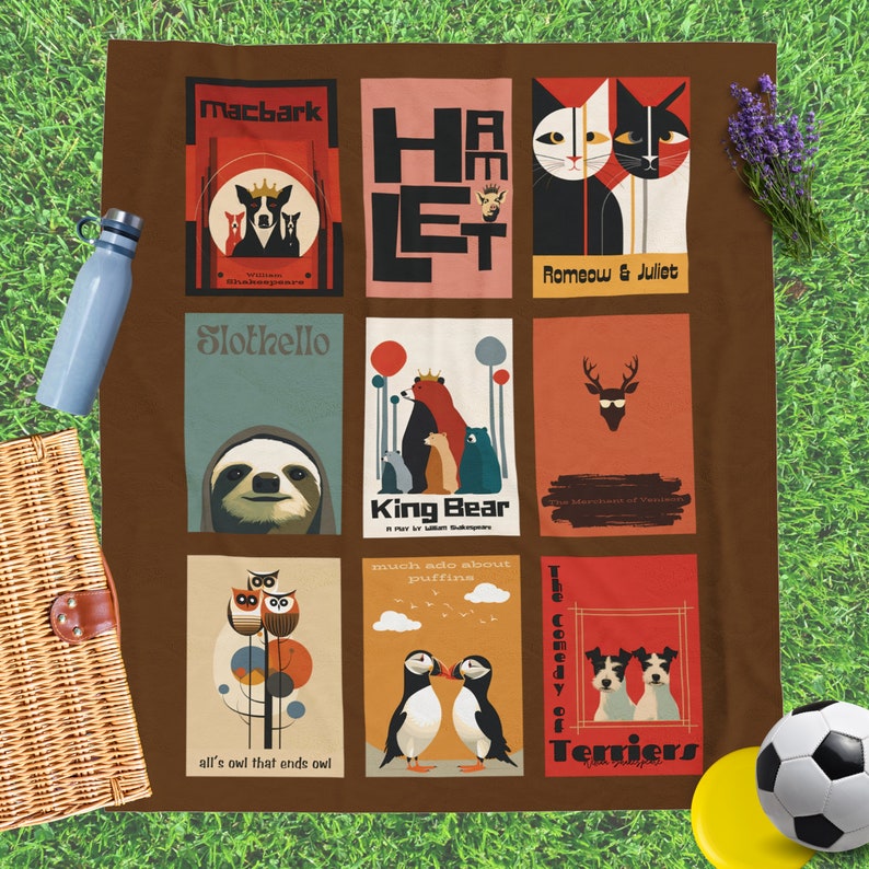 May include: A brown picnic blanket with nine colorful squares featuring illustrations of animals and text from Shakespeare plays. The squares include Macbark, Hamlet, Romeow & Juliet, Slothello, King Bear, The Merchant of Venice, much ado about puffine, all's owl that ends owl, and The Comedy of Terriers.