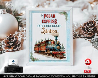 May include: A framed print with the text "The Polar Express Hot Chocolate Station" above an illustration of a vintage train. The print has a white border and is decorated with sprigs of greenery.