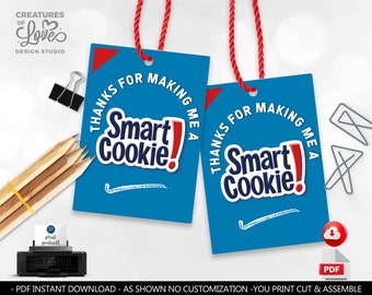 May include: Two blue and red printable gift tags with the text "Thanks for making me a Smart Cookie!"  The tags are designed to be cut out and assembled with string.