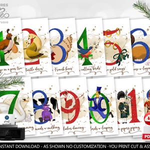 May include: A set of twelve Christmas-themed cards, each featuring a number and a corresponding illustration from the song "The Twelve Days of Christmas." The cards have a white background with gold accents and festive imagery.