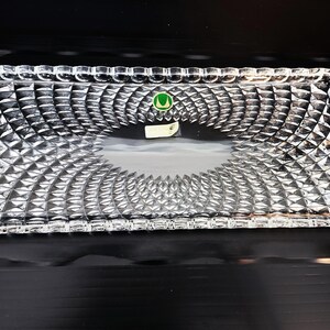 May include: A rustic wooden sign with the text "Welcome to our home" in a handwritten style. The sign features a distressed finish and a simple, inviting design, perfect for a front porch or entryway.