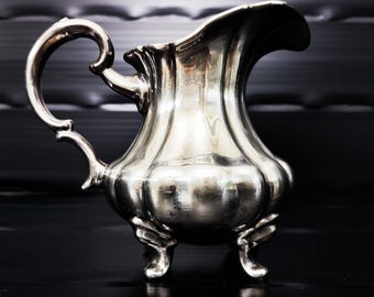 Porcelain milk jug from the silverware factory Gebrüder Deyhle/fine silver plating 1000/000/ Rococo style