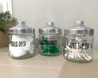 Funny Glass Bathroom Apothecary Jars: Balls Deep, Just the Tip, Crack Cleaners, and Rub One Out.  Can also personalize with your own phrase.