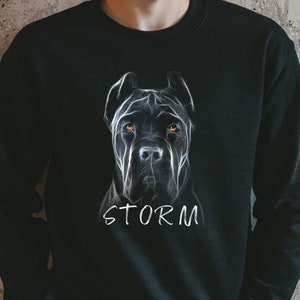 May include: Black sweatshirt with a white outline of a Cane Corso dog's head and the word "STORM" printed below the image.