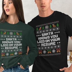 May include: A dark green sweatshirt and a black t-shirt with a festive holiday design. The design includes reindeer, Christmas trees, snowflakes, and the text "SANTA KNOWS YOU LIED ON YOUR RESUME." A Christmas theme.