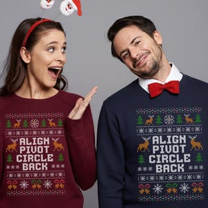 May include: Two people wearing matching Christmas sweaters. The burgundy sweater has the text "ALIGN PIVOT CIRCLE BACK" with reindeer and Christmas tree designs. The navy sweater has the same text and design. A Santa headband and red bow tie complete the festive look.