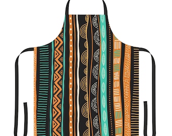 Könnte beinhalten: Eine schwarze Schürze mit einem farbenfrohen geometrischen Muster in Orange, Gelb, Türkis und Weiß. Das Muster besteht aus Streifen, Punkten und Wellenlinien.